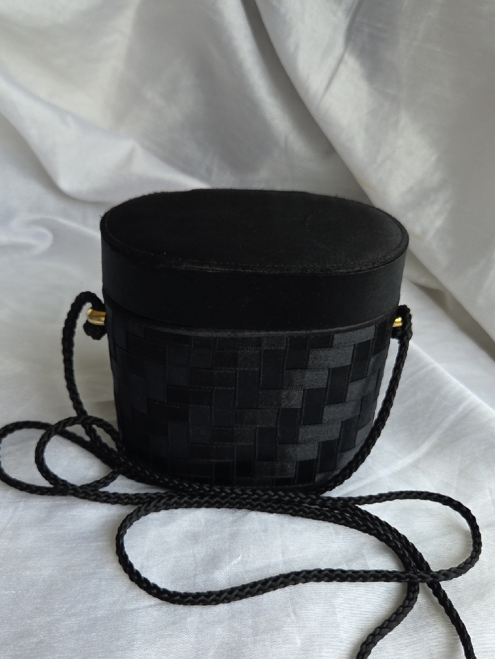 La Regale Black Woven Oval Crossbody Bag